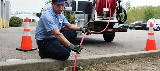 Technician operating cast iron descaling and hydro jetting equipment in Oceanside - Hydro Jet Experts